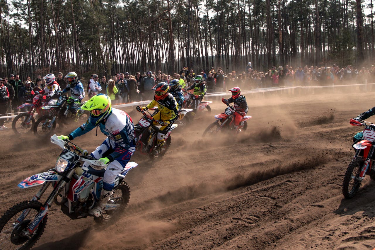 Intense motocross competition with riders racing on a dirt track in Slovakia.